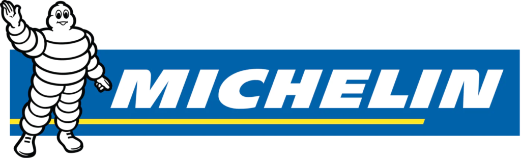 Michelin-logotyp med Michelin-mannen, en vit, däckformad karaktär, som viftar bredvid ordet "MICHELIN" i djärva vita bokstäver på en blå bakgrund med en gul rand under.